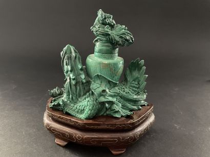 null 
Malachite statuette carved in the shape of a dragon forming a vase.




H :...