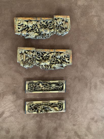null 
Two pairs of decorative elements in carved and gilded wood. One with guanine...