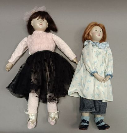 
Two dolls, leather effect skin, with slanted...