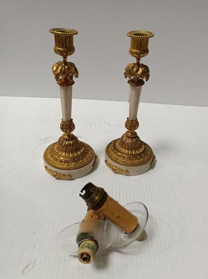 null 
Pair of small white marble and gilt bronze torches decorated with vine branches....