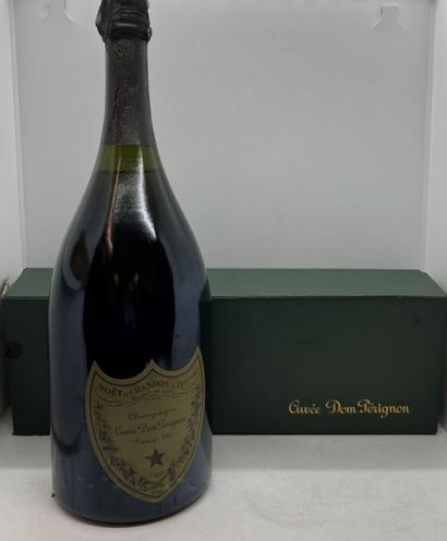 null 1 magnum of DOM PERIGNON 1983, high shoulder, in its stained and damaged bo...