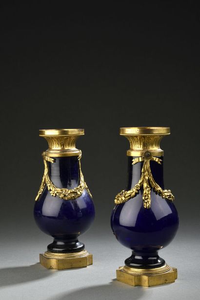 null Pair of blue glass baluster vases with gilt bronze mountings decorated with...