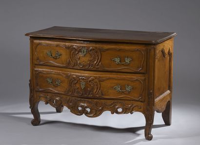 null Walnut chest of drawers, carved with foliage, cambered legs with scrolls, two...