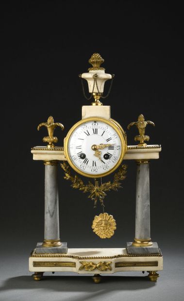 null Small portico clock with columns in turquoise marble. The enamelled dial surmounted...