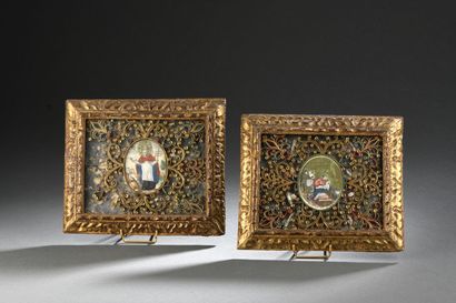 null Two reliquaries with paperolles, each centered with an engraved medallion, in...
