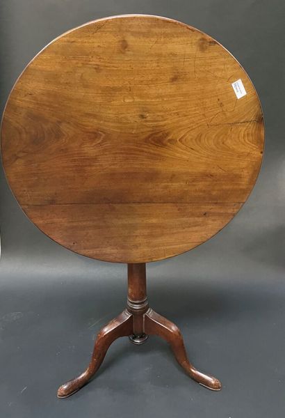 null Pedestal table in mahogany with a tilting top, the latter rests on a shaft with...