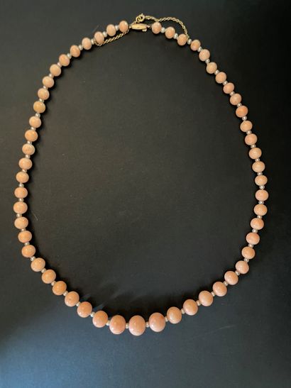 Necklace of coral balls in fall and alternating...