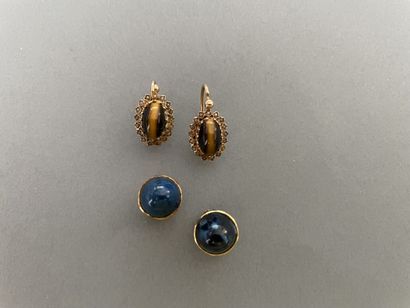 Lot including:
- a pair of ear studs adorned...