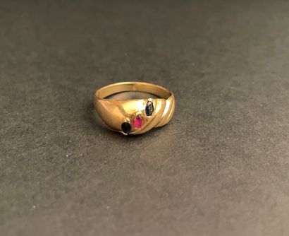 Twisted yellow gold ring set with a ruby...
