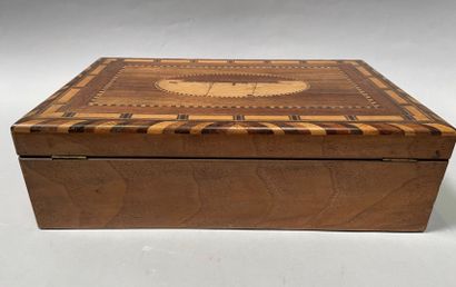 null Marquetry box with steamboat decoration, circa 1900.

Interior divided into...