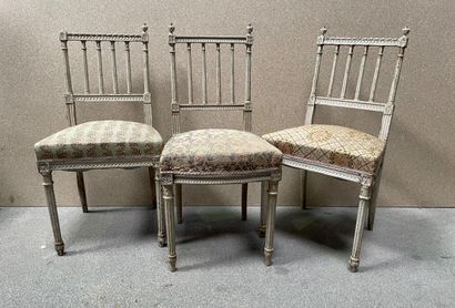 null Suite of three molded and lacquered wood chairs with columned backs, tapered...