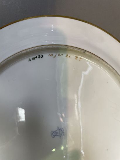 null Plate in porcelain of Sevres with marbled blue bottom with decoration in gilding...