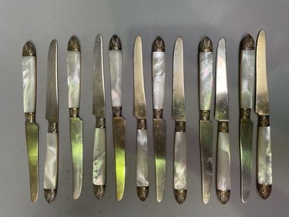 null Twelve fruit knives with mother-of-pearl handle and vermeil blade.

Gross weight...