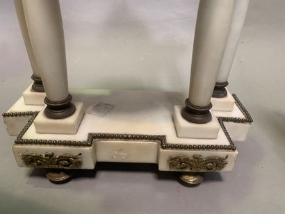null Marble mantel set including a portico clock and a pair of cassolettes. The whole...