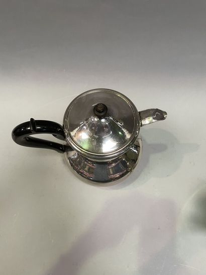 null Teapot of baluster form out of silver plated metal and blackened wooden catch.

H...