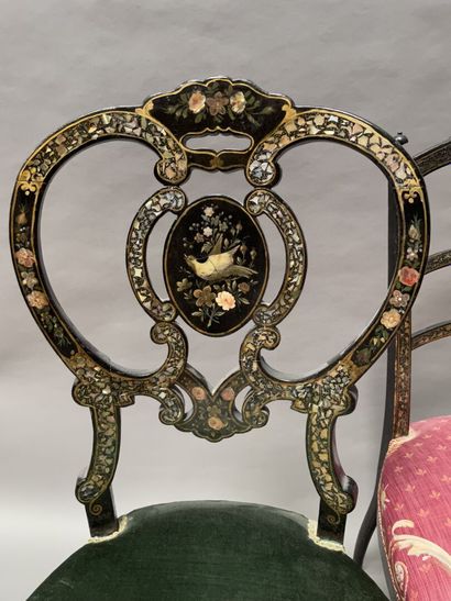 null Two low chairs in blackened wood with gilding and burgundy decoration. 

Napoleon...