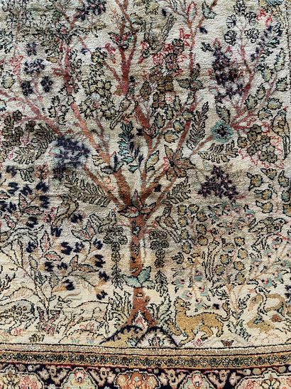 null 
Silk carpet decorated with birds in a tree, on beige background.

158 x 99...