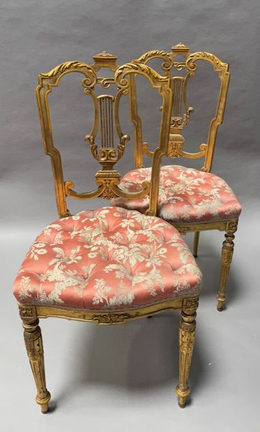 Pair of chairs in gilded wood and carved...