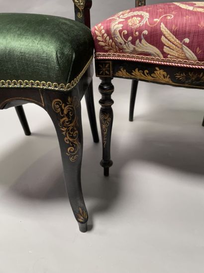 null Two low chairs in blackened wood with gilding and burgundy decoration. 

Napoleon...
