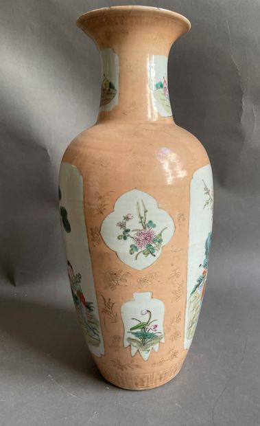 null 
CHINA

Porcelain vase decorated with characters in reserves on pink background....