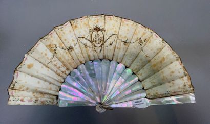 null Fan, the strands in mother-of-pearl, the leaf decorated with a gallant scene...