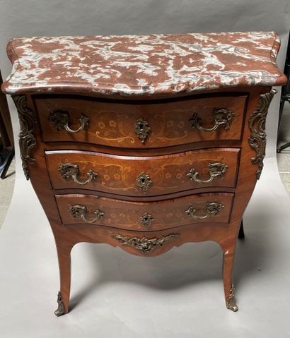 null Wooden chest of drawers inlaid with flowers, opening with three drawers, cambered...