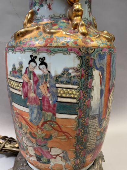 null A Canton porcelain baluster vase with polychrome enamelled courtesans mounted...