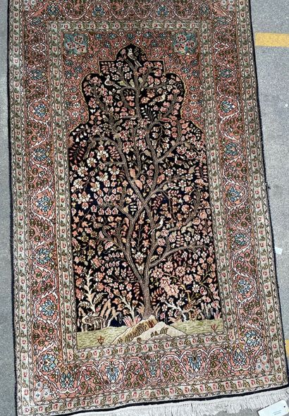 Three rugs :

Silk prayer rug decorated with...