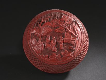 Round box in cinnabar lacquer with carved...