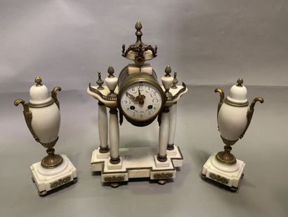 null Marble mantel set including a portico clock and a pair of cassolettes. The whole...