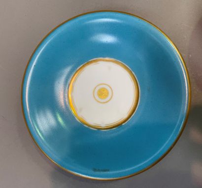 null A turquoise and gilt enameled porcelain bowl and its display stand.

Paris,...