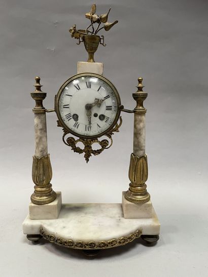 Portico clock in marble and gilded bronze...