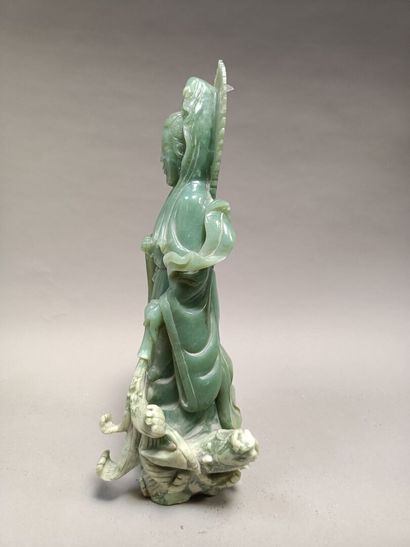 null Jade statue of a Buddha knocking over a vase.

China, 20th century.

Height...
