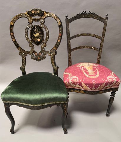 Two low chairs in blackened wood with gilding...