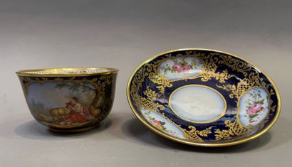 null Porcelain cup and saucer decorated with country scenes and flowers in reserves...