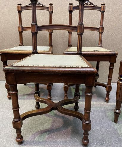 null Suite of three chairs in molded wood with openwork back, the legs joined by...