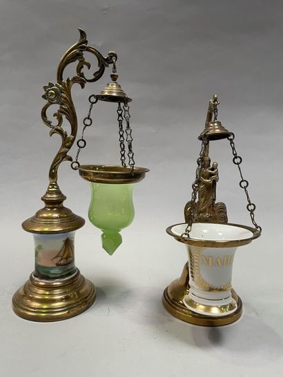 null Two suspended oil lamps in brass, one with a shaft decorated with enamelled...