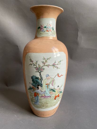 null 
CHINA

Porcelain vase decorated with characters in reserves on pink background....