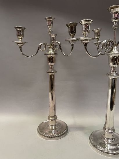 null Pair of silver plated metal torches with four scrolled lights.

Louis XVI style

H...