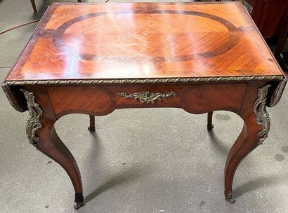 null Writing table in rosewood veneer, the top with two small flaps and a drawer...