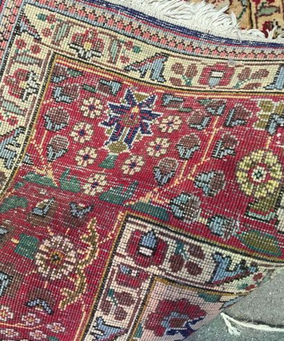 null Two wool carpets, one with a blue and red medallion motif on a beige background,...