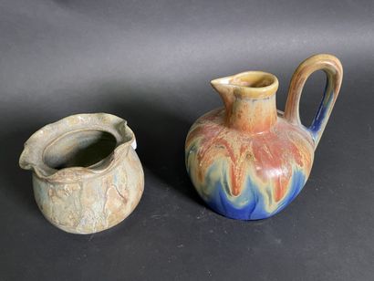 null Gilbert METENIER

Flamed stoneware pitcher decorated with orange and blue coulures

Signed...
