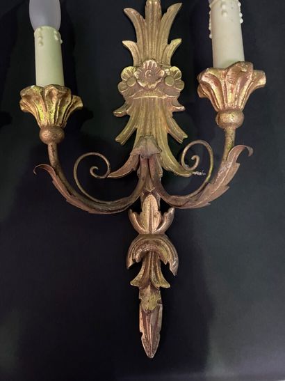 null Pair of two-light sconces in gilded wood, the shaft surmounted by a cornucopia...