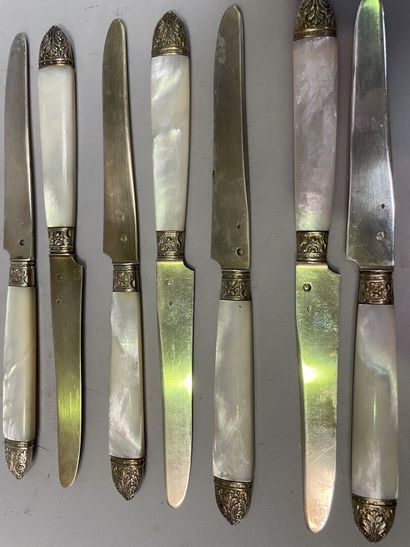 null Twelve fruit knives with mother-of-pearl handle and vermeil blade.

Gross weight...