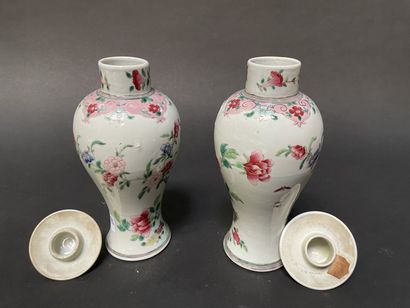null Two covered baluster vases decorated with peonies and roosters.

China, 19th...