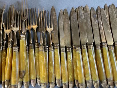 null Set of forks and fruit knives in gilded metal and resin

and a set of large...