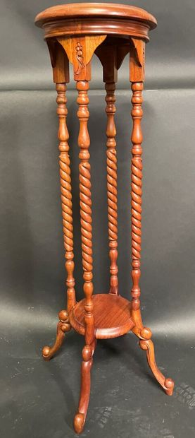 null Turned, molded and carved wood saddle with four feet joined by a strut, the...