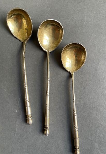 null Three silver spoons with black enameled scrolls.

Russian work from the beginning...