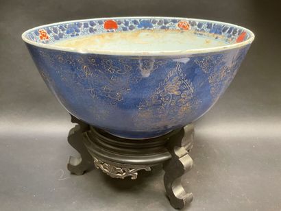 null Large porcelain bowl with a powder blue background, gold enamelled with flowers...