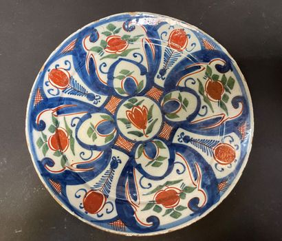 Earthenware plate decorated with flowers

Delft,...